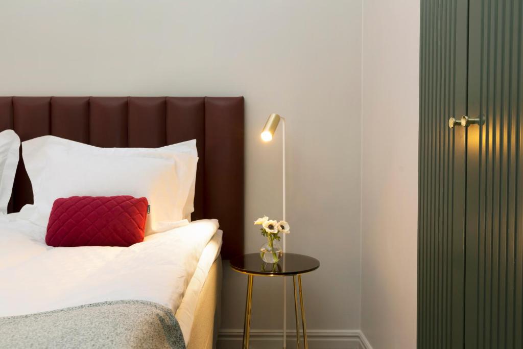 Postel nebo postele na pokoji v ubytování Elite Hotel Adlon