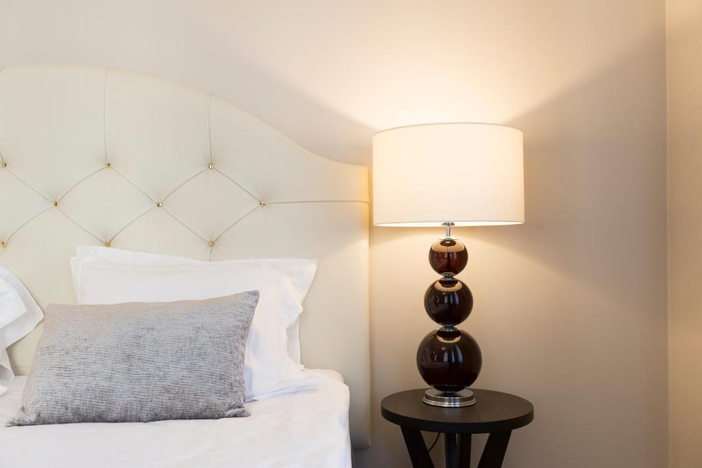 Postel nebo postele na pokoji v ubytování Elite Hotel Adlon