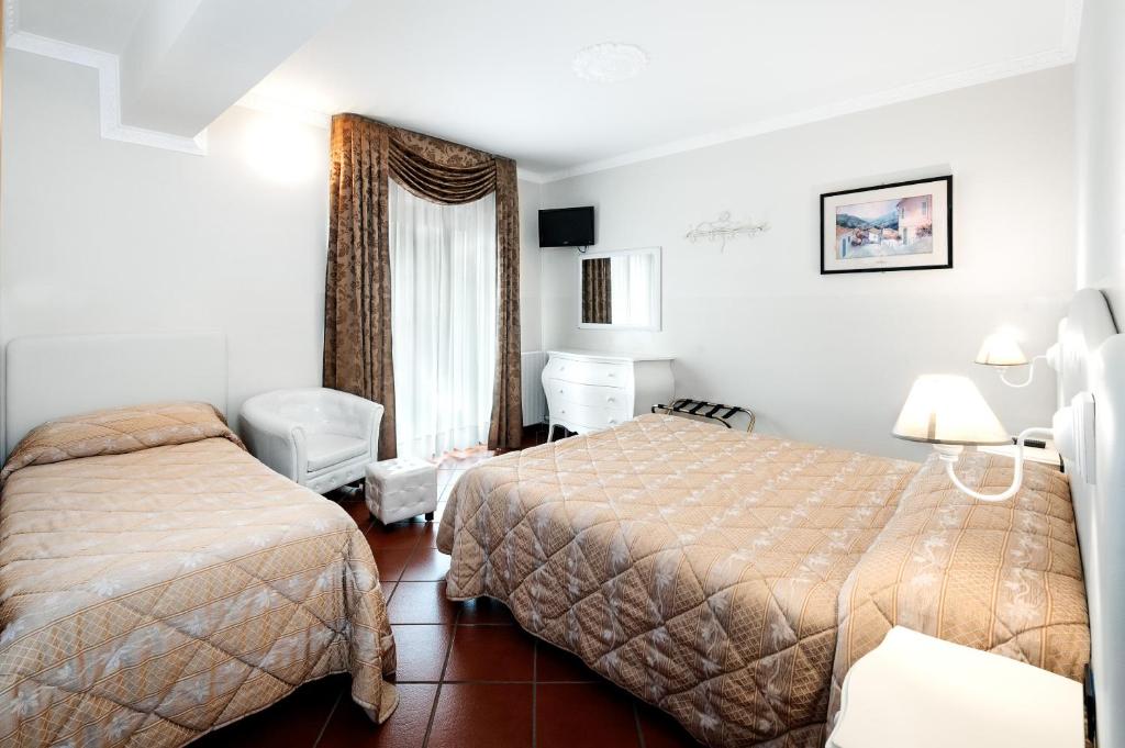 Postel nebo postele na pokoji v ubytování Hotel Edelweiss