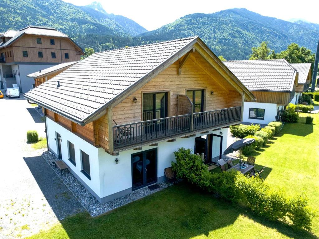 an aerial view of a house with mountains in the background at Rattendorf 23B in Rattendorf