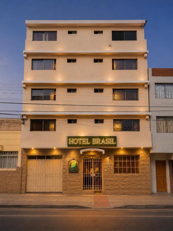 a building on a street with a hotel branch at Hotel Brasil in Antofagasta