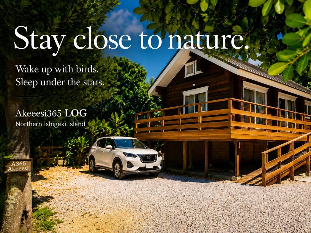 a car parked in front of a house at 石垣島コテージAkeeesi365 LOG in Ishigaki Island