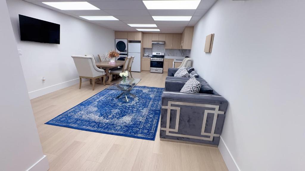 a living room with a couch and a table at Entire condo in White Rock, Canada in White Rock
