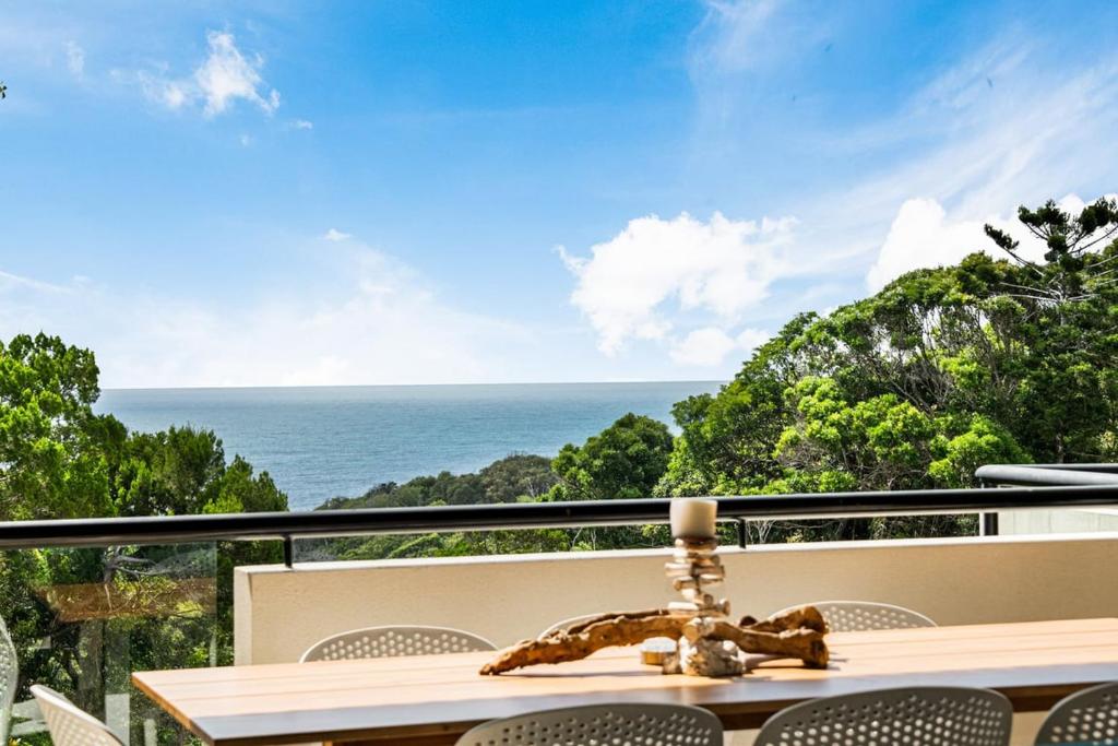 a view of the ocean from a balcony at Villa Mariposa in Coolum Beach