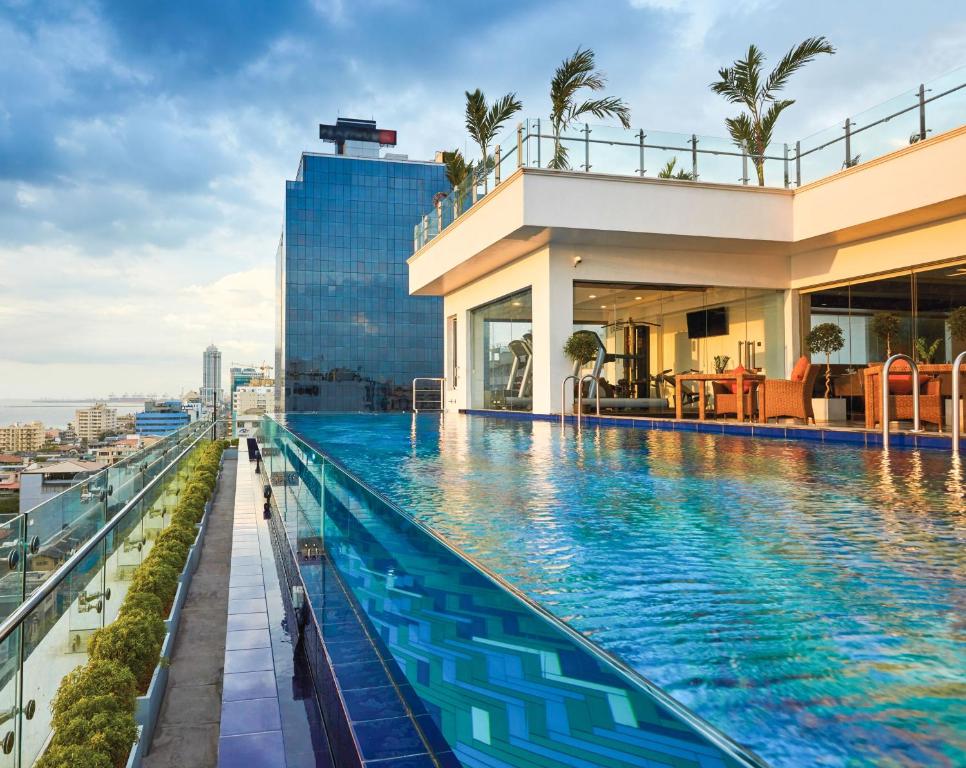 a swimming pool on the roof of a building at Mandarina Colombo in Colombo