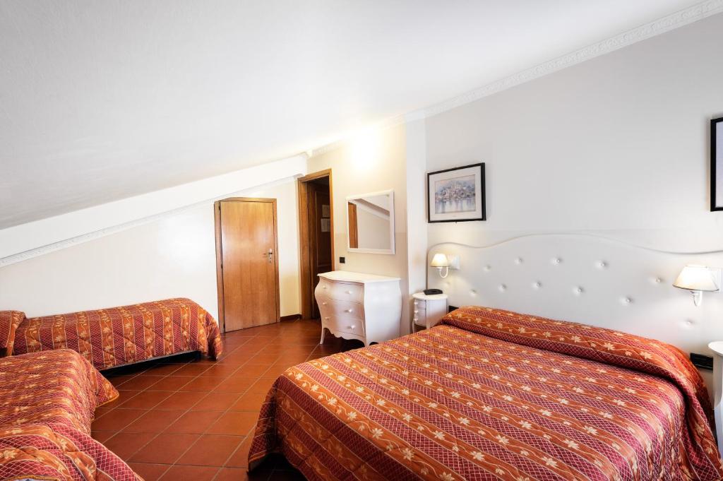 Postel nebo postele na pokoji v ubytování Hotel Edelweiss