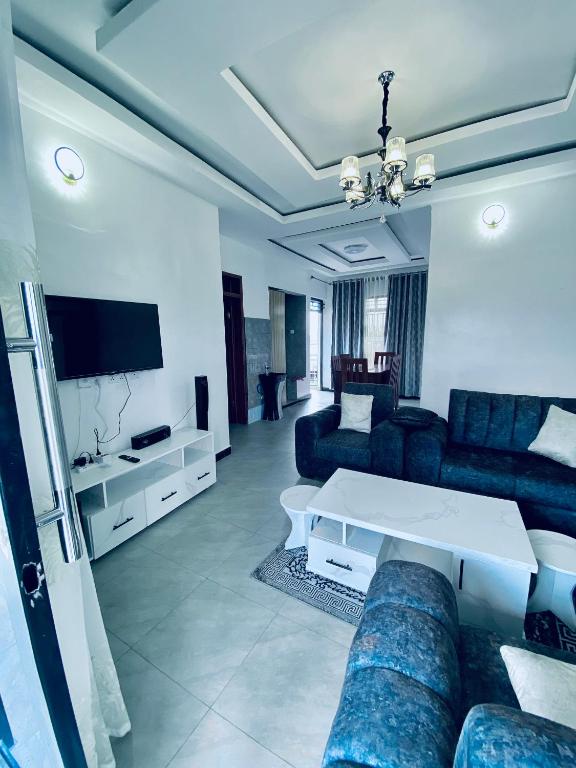 a living room with a couch and a table at basalt&bamboo B&B in Ruhengeri