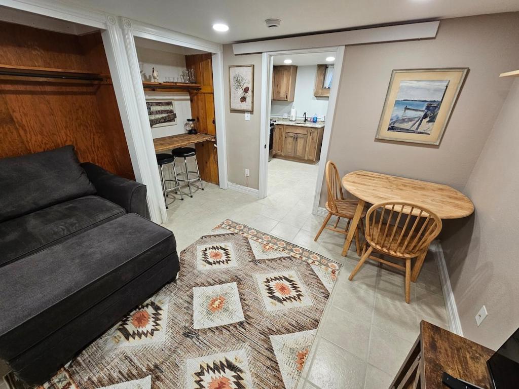 a living room with a couch and a table at The Cottonwood Den in Laramie