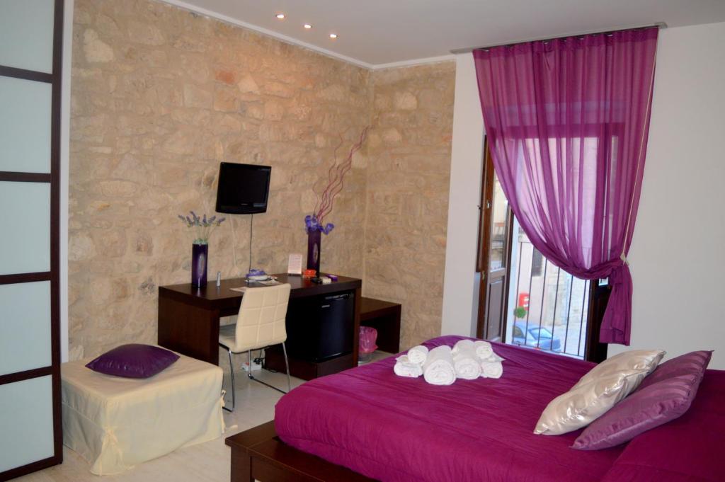 Postel nebo postele na pokoji v ubytování Abraxia B&B