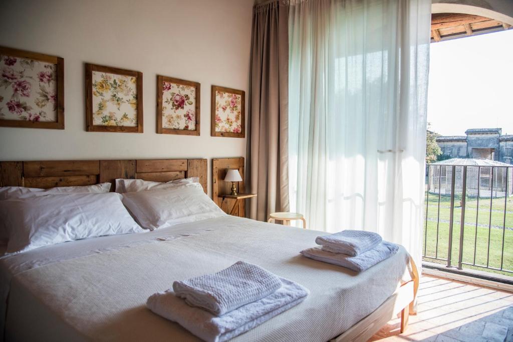 Postel nebo postele na pokoji v ubytování Agriturismo Corte Ruffoni