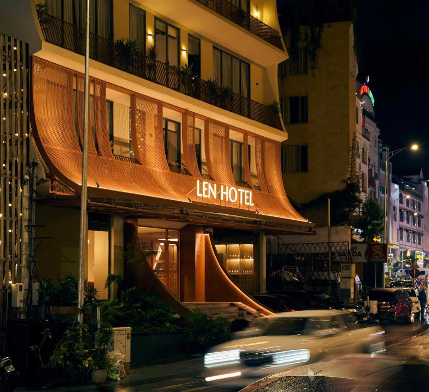 a car driving in front of a hotel at night at Len Hotel in Da Lat