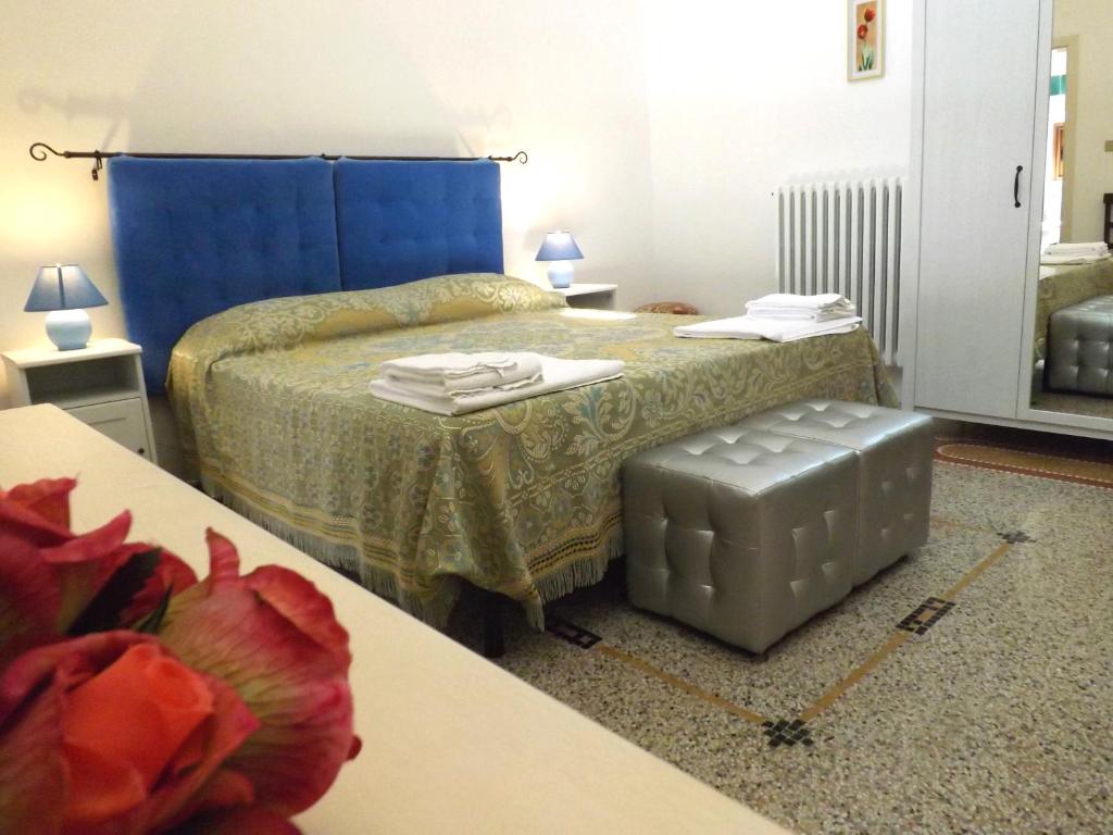 A bed or beds in a room at Ugento Dimora