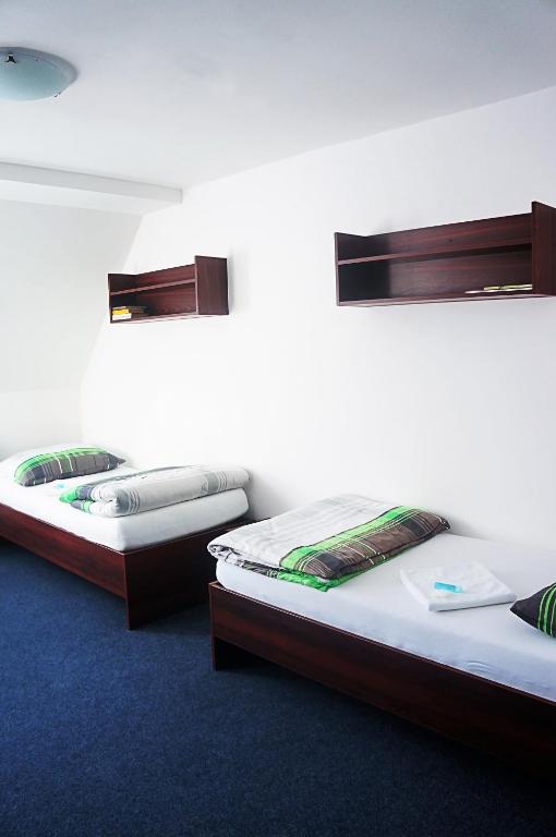 Posteľ alebo postele v izbe v ubytovaní Hotel Pivovar Kácov