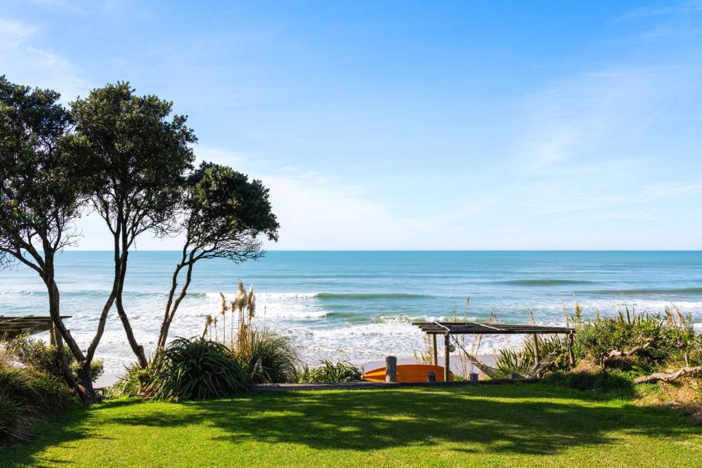 a view of the ocean from a beach at Beachfront Kiwi bach with direct beach access in Gisborne