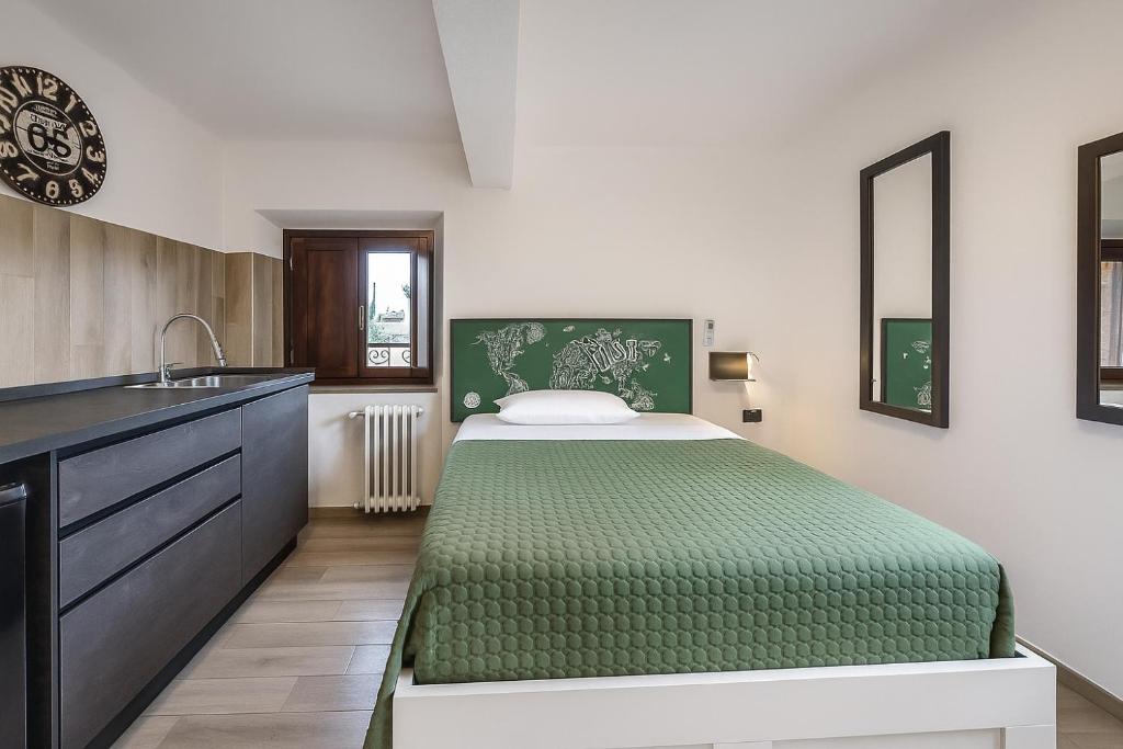 a bedroom with a bed and a sink at Maserati House - H24 in Modena