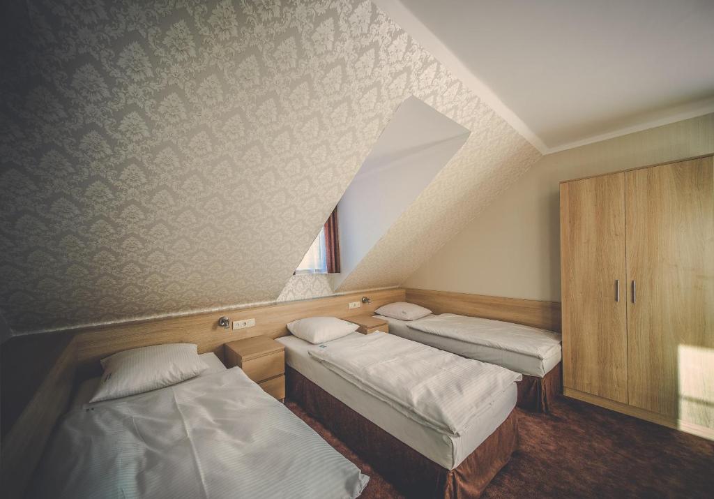Postel nebo postele na pokoji v ubytování Pokoje gościnne Truskawkowa 1a