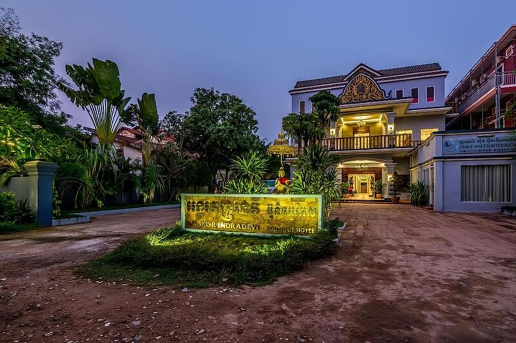 a large house with a sign in front of it at Raksmey Angkor Boutique in Siem Reap