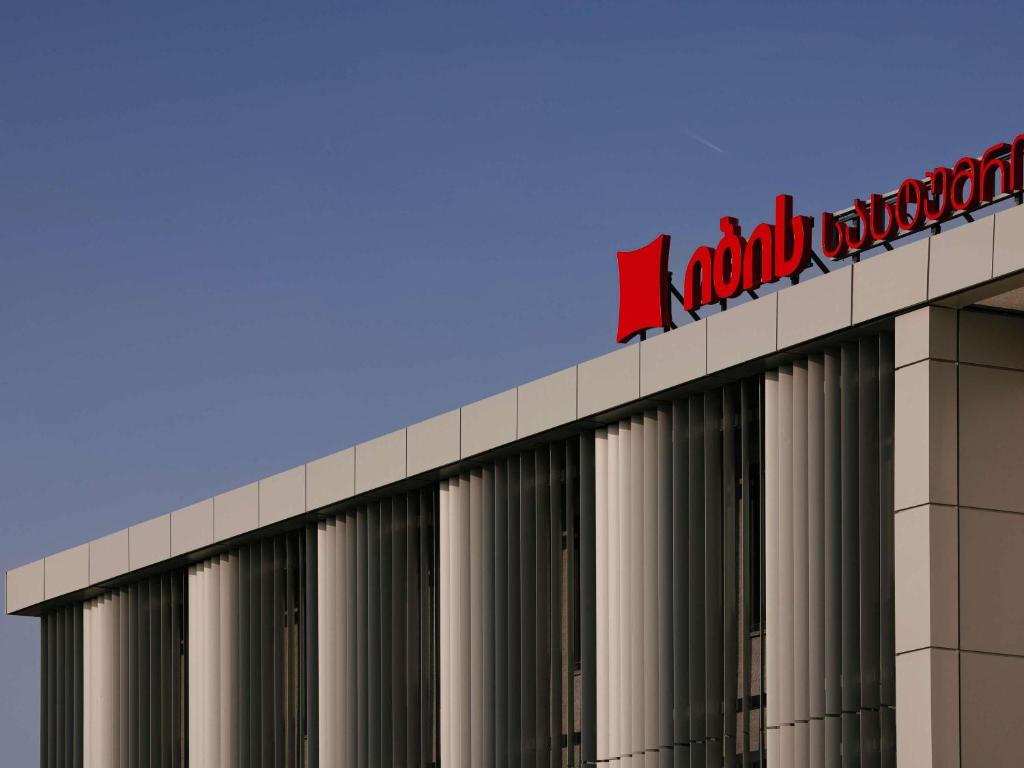 a sign on the top of a building at ibis Tbilisi Airport in Tbilisi City