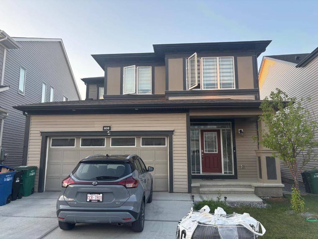 a car parked in front of a house at Peniel Place in Airdrie