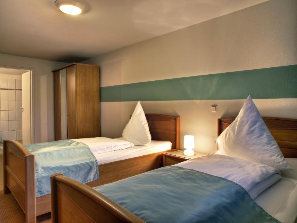 Krevet ili kreveti u jedinici u okviru objekta NOEL Hotel-Restaurant