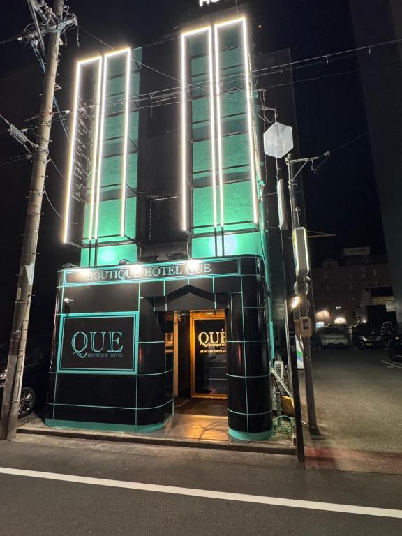 a building with aire sign in front of it at night at Que キュー -レジャーホテル in Shizuoka