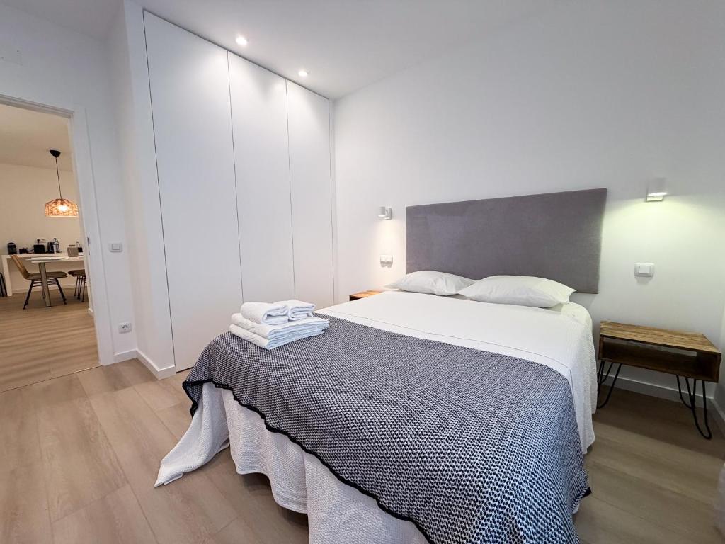 a bedroom with a large bed in a room at Dani's House - Nazaré in Nazaré
