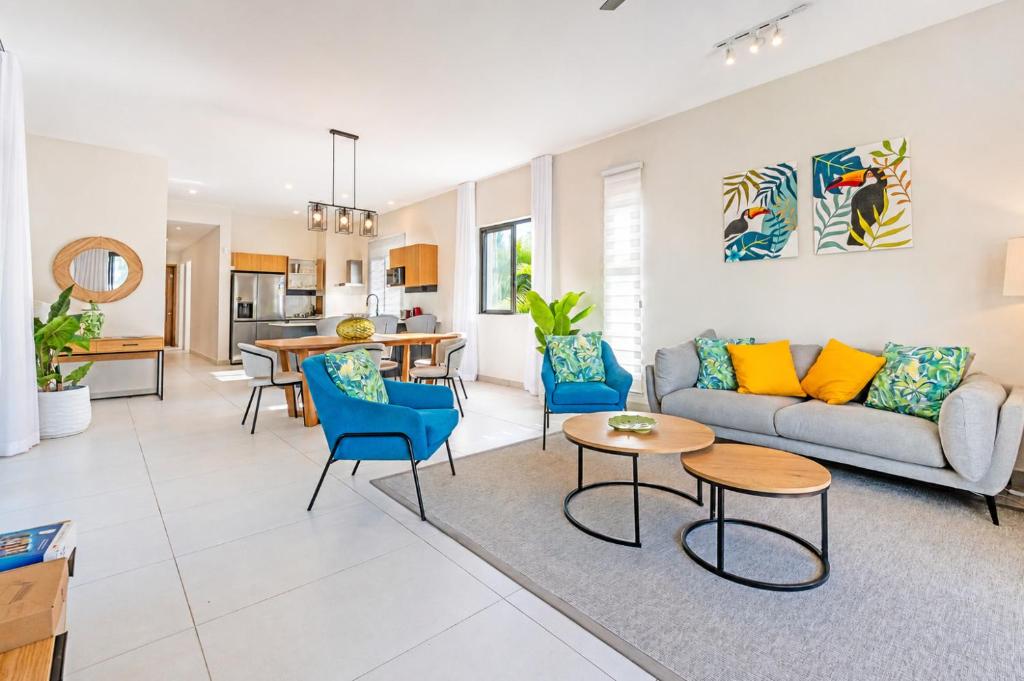 a living room with a couch and chairs and a table at SALTA apartment l Complex Ocean terraces in Poste Lafayette