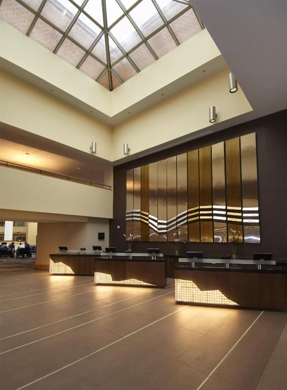 a large lobby with large windows and tables at Hyatt Regency Princeton in Princeton