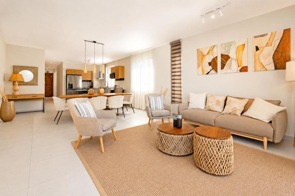 a living room with a couch and a table at PARATY Apartment l Complex Ocean Terraces in Poste Lafayette