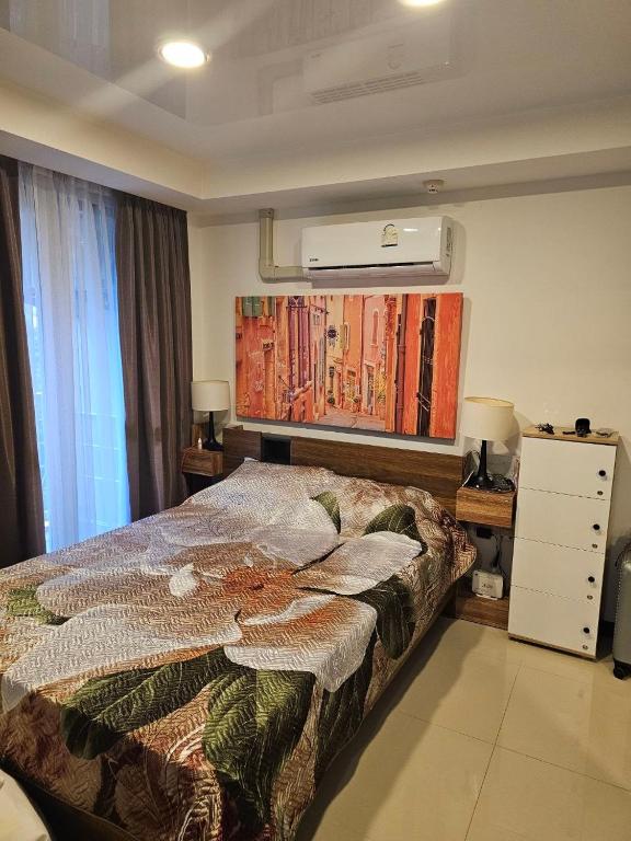 a bedroom with a bed and a air conditioner at Vacation by the ocean in Phuket