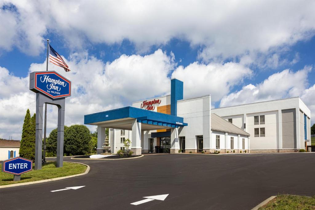 a gas station with a sign in front of it at Hampton Inn Morristown in Morristown
