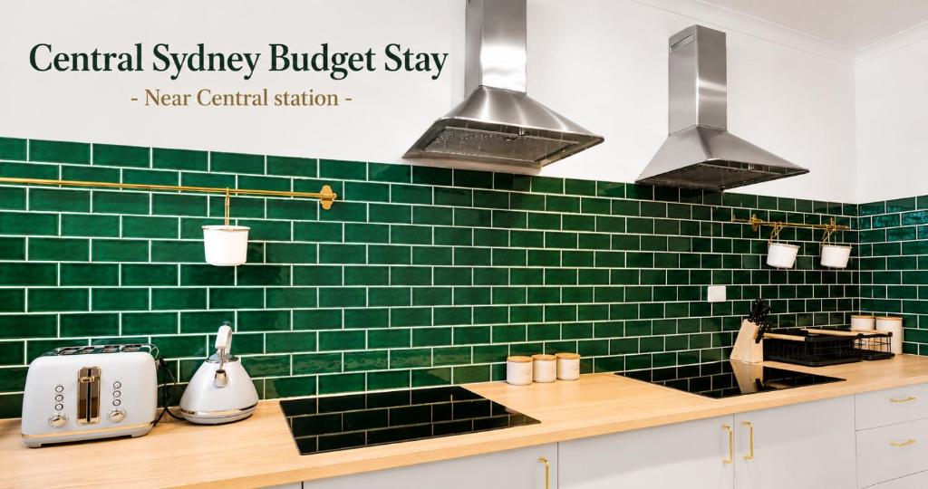 a kitchen with green tiled walls and a counter at Central Sydney Budget Stay - Near Central Station in Sydney