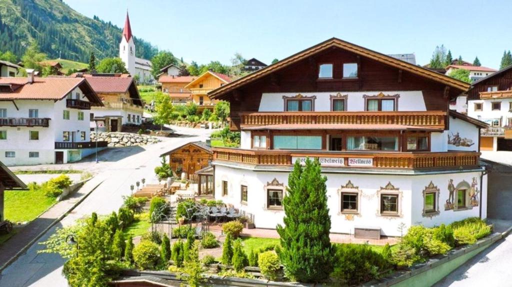 a house in the middle of a village at Hotel-Restaurant Edelweiẞ in Berwang