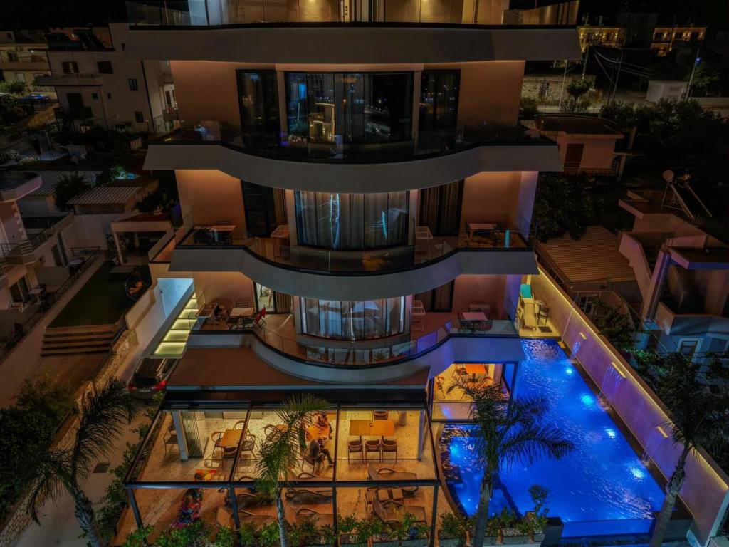 an aerial view of a building with a swimming pool at Hotel Olserd in Ksamil