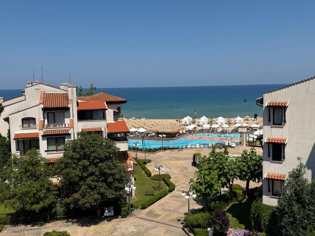 a view of a resort with a swimming pool and the ocean at Seaside Luxury Apartment - Lozenetz in Lozenets