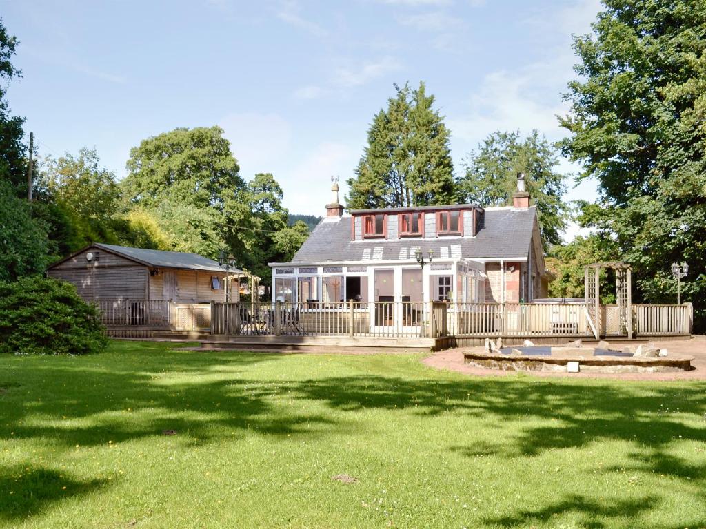 a house with a large yard in front of it at Burnbeag - Svve in Balloch