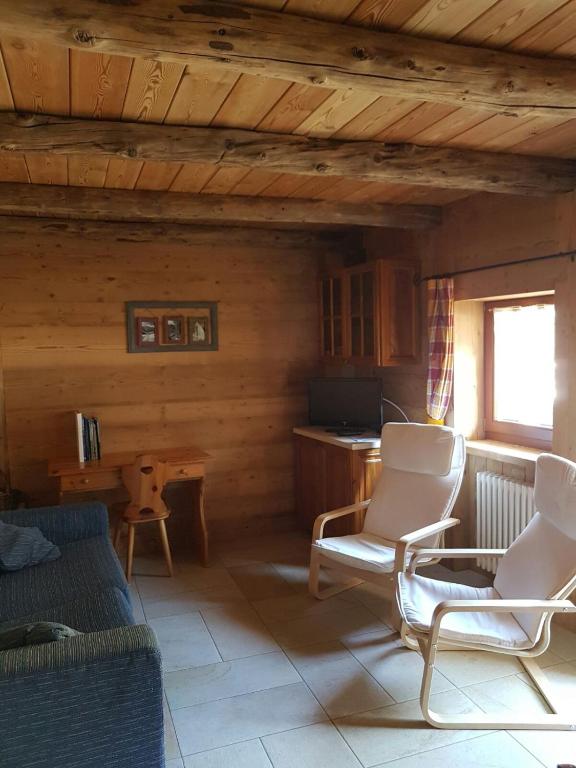 a living room with two chairs and a table at Appartamento Le Jardin CIR VDA Aymavilles 0009 in Aymavilles
