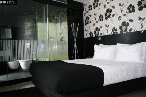 Postel nebo postele na pokoji v ubytování Funchal Design Hotel