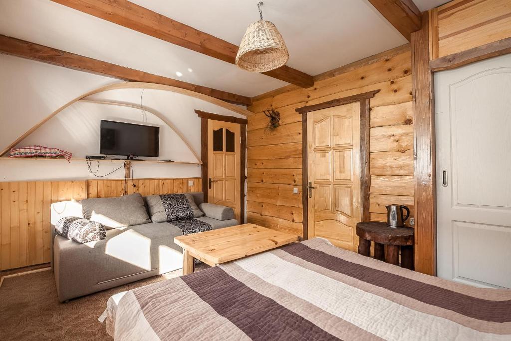 Postel nebo postele na pokoji v ubytování Vatra Hotel