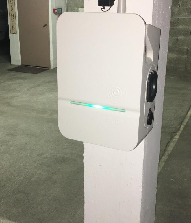 a white refrigerator with a blue light on it at Hôtel Ulysse Montpellier Centre in Montpellier