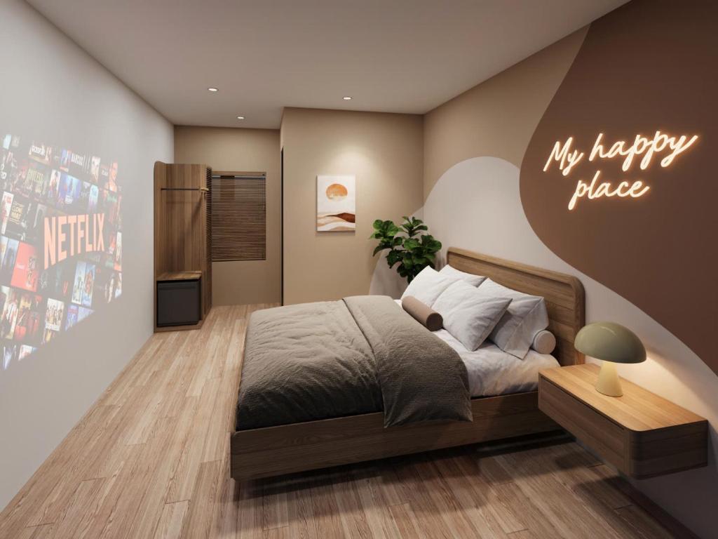 a bedroom with a bed and a my happy place sign at Sanora Hotel in Hanoi
