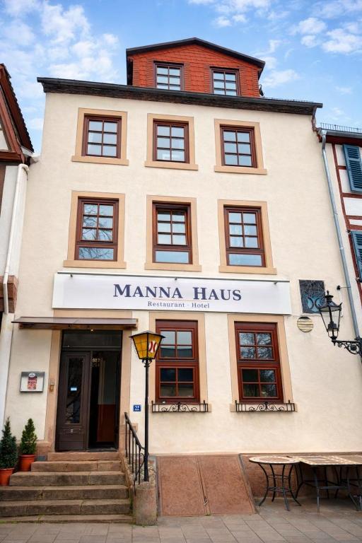 a building with a sign that reads manma haus at Manna Haus in Gelnhausen