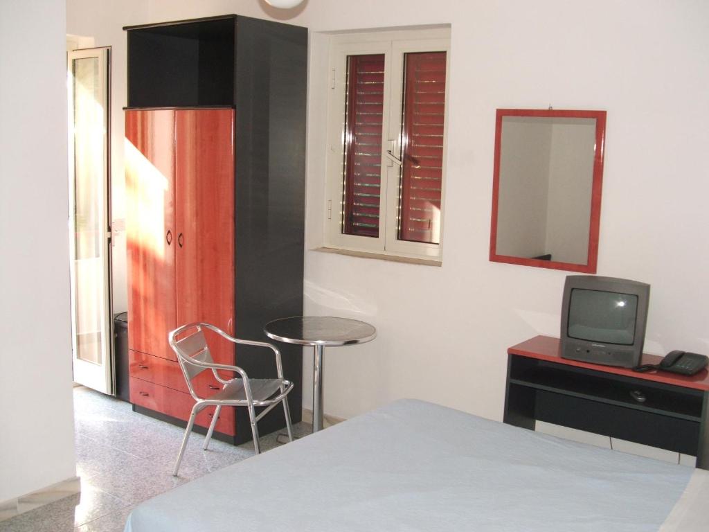 Postel nebo postele na pokoji v ubytování Hotel Piccolo Paradiso