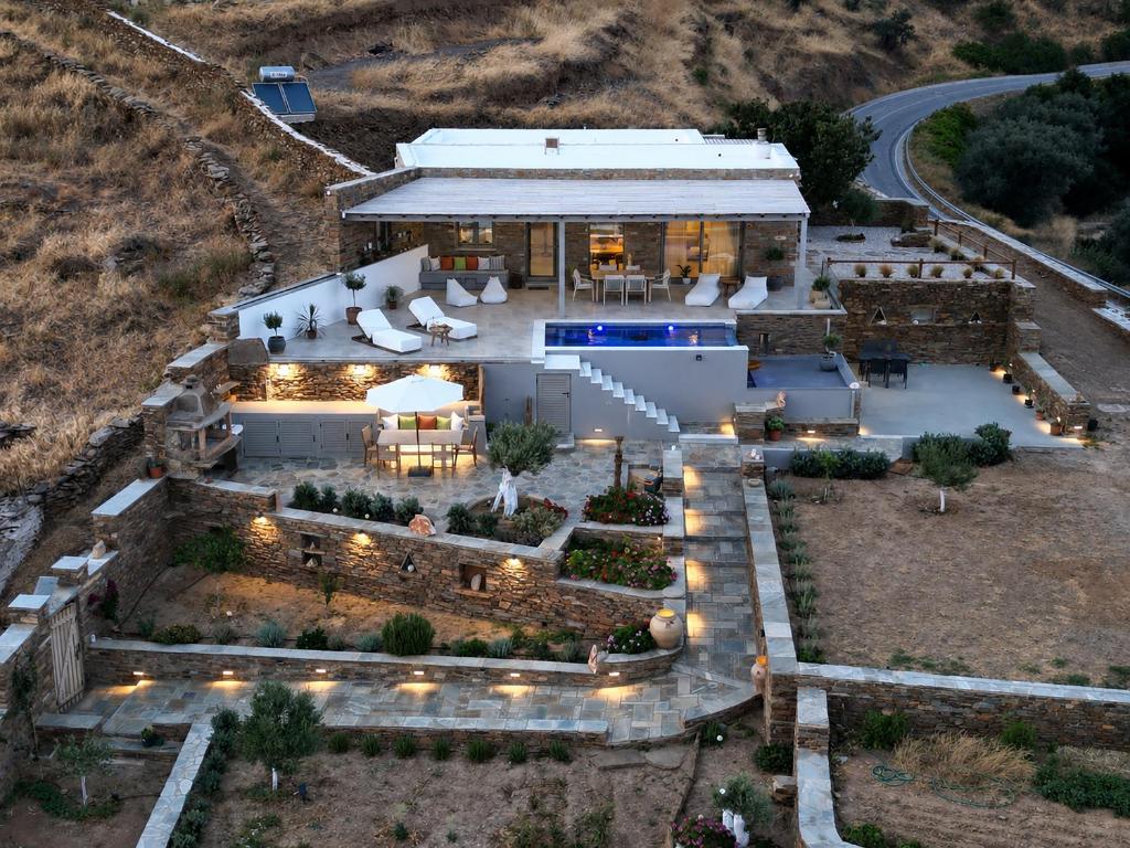 an aerial view of a house with a garden at Horizon Hill Villa in Tinos