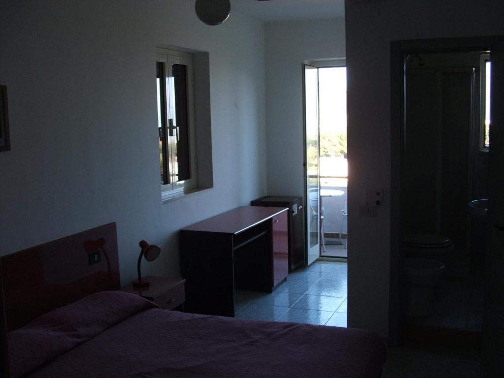 Postel nebo postele na pokoji v ubytování Hotel Piccolo Paradiso