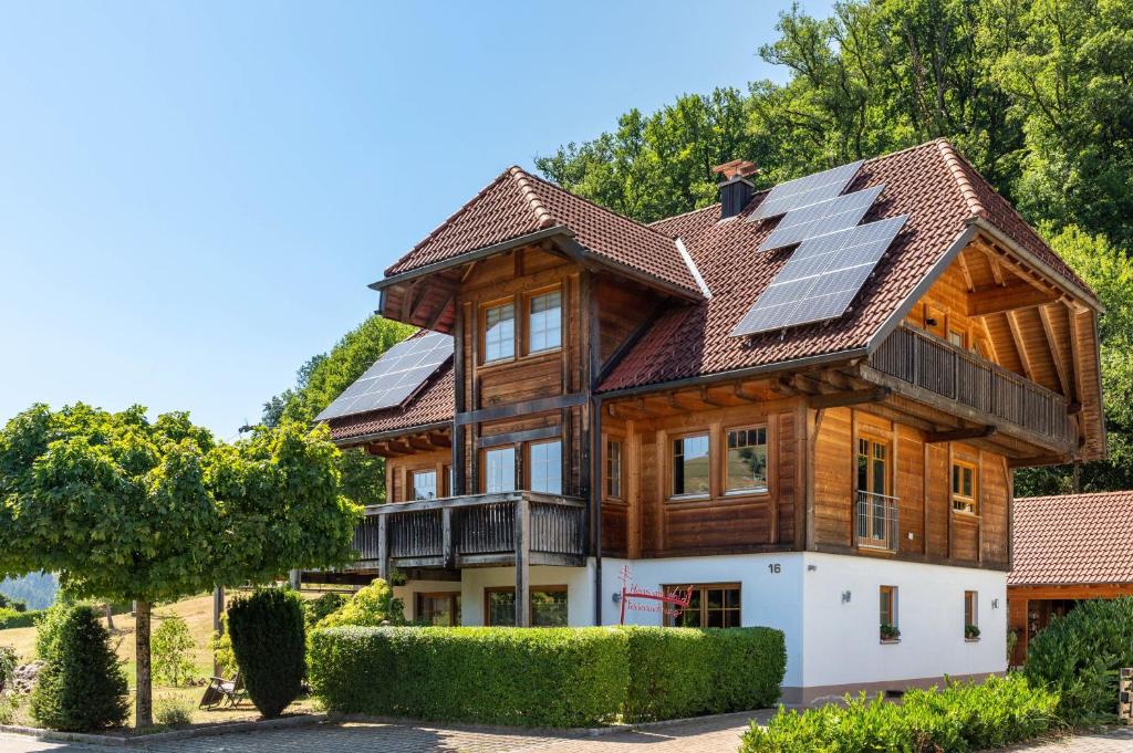 a house with solar panels on the roof at Haus am Wald in Münstertal