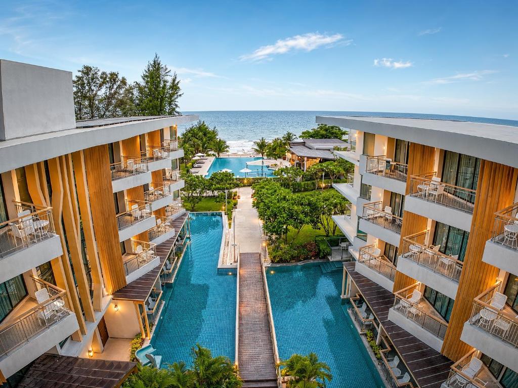 an aerial view of a resort with a swimming pool at Sand Dunes Chaolao Beach Resort in Chao Lao Beach