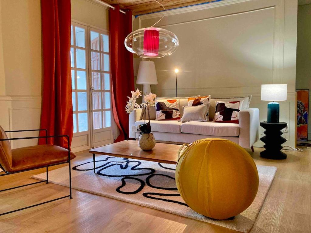 a living room with a couch and a table at Villa Bourbon Pointu - Hiking & Spa in La Plaine des Palmistes