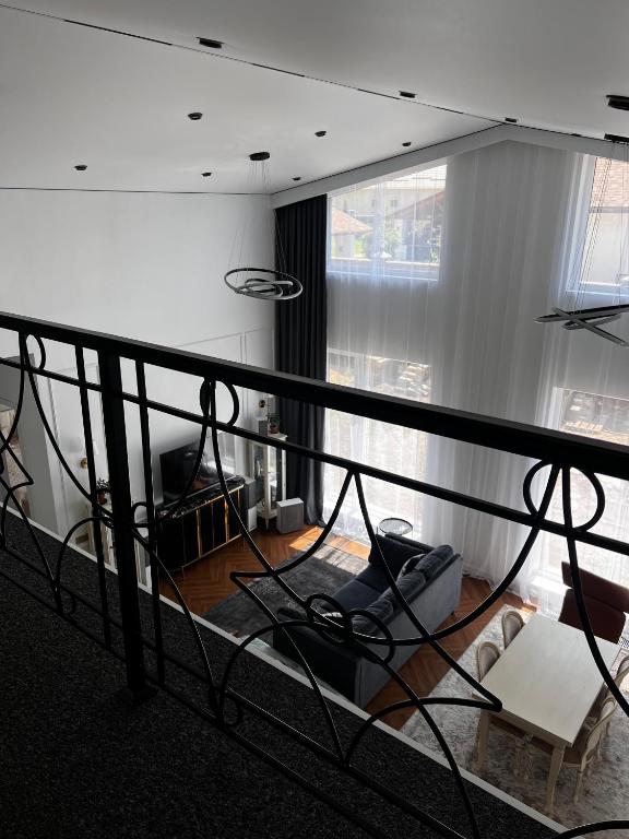 a view of a living room with a balcony at LouLou Hills in Uchastkovoyye Khozyaystvo SKhI