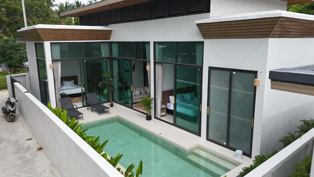 an aerial view of a house with a swimming pool at Neon Villa in Ko Phangan